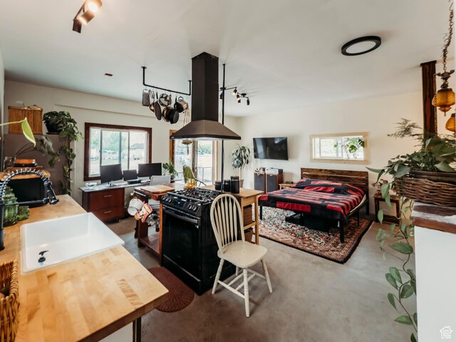 1 S 3rd Ave, Helper, UT 84526 - bedroom with track lighting, a desk, and a sink