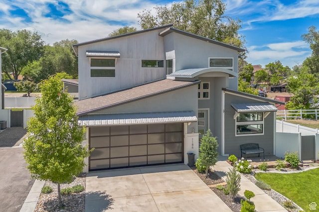 1186 W Marinwood Ave, Murray, UT 84123 - modern home featuring concrete driveway and stucco siding