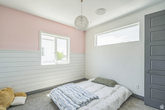 1186 W Marinwood Ave, Murray, UT 84123 - carpeted bedroom featuring wooden walls and wainscoting