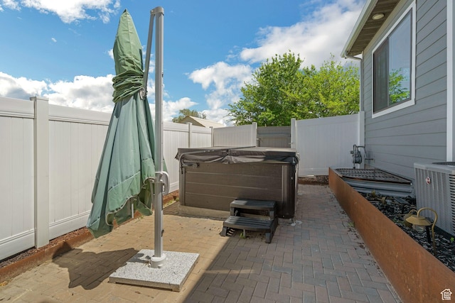 1186 W Marinwood Ave, Murray, UT 84123 - fenced backyard featuring a hot tub, a patio, and central AC
