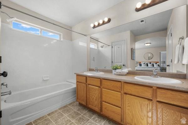 8064 N Clearwater Rd, Eagle Mountain, UT 84005 - ensuite bathroom featuring shower / bathtub combination and double vanity