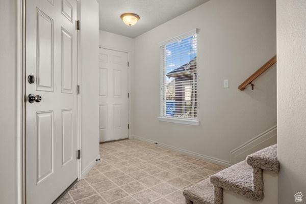 8064 N Clearwater Rd, Eagle Mountain, UT 84005 - foyer featuring stairs and baseboards