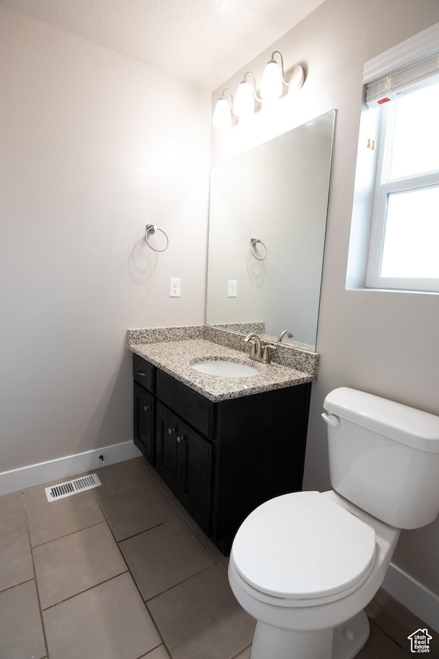 182 W Braeburn Ln, Santaquin, UT 84655 - bathroom with toilet, vanity, baseboards, and tile patterned flooring
