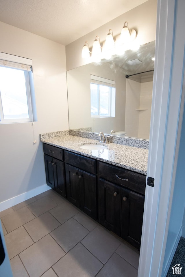 182 W Braeburn Ln, Santaquin, UT 84655 - bathroom featuring vanity, tile patterned flooring, and baseboards