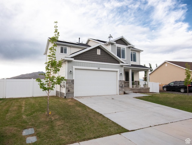 182 W Braeburn Ln, Santaquin, UT 84655 - craftsman-style home with covered porch, stone siding, a garage, and board and batten siding