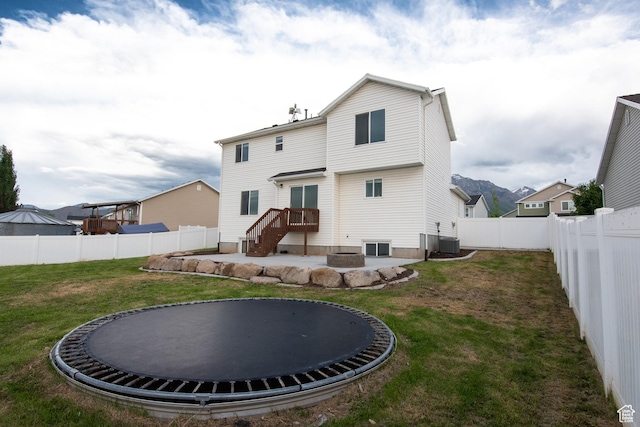 182 W Braeburn Ln, Santaquin, UT 84655 - rear view of house with a trampoline and central air condition unit