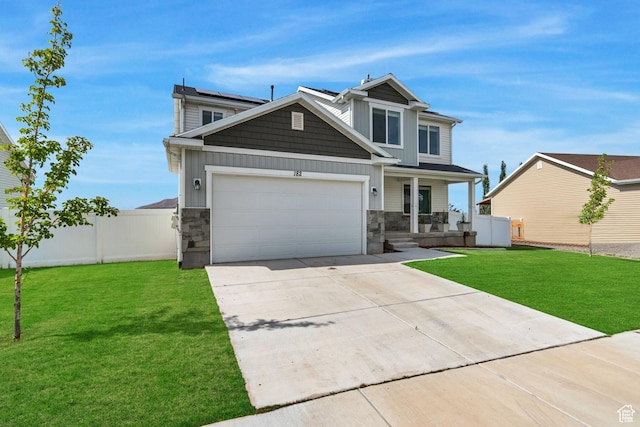 182 W Braeburn Ln, Santaquin, UT 84655 - view of front of home with covered porch, stone siding, concrete driveway, and an attached garage