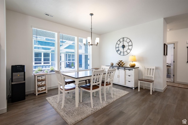 3795 S 4250 W Unit 446D, West Haven, UT 84401 - dining space with a chandelier, dark wood-type flooring, and baseboards