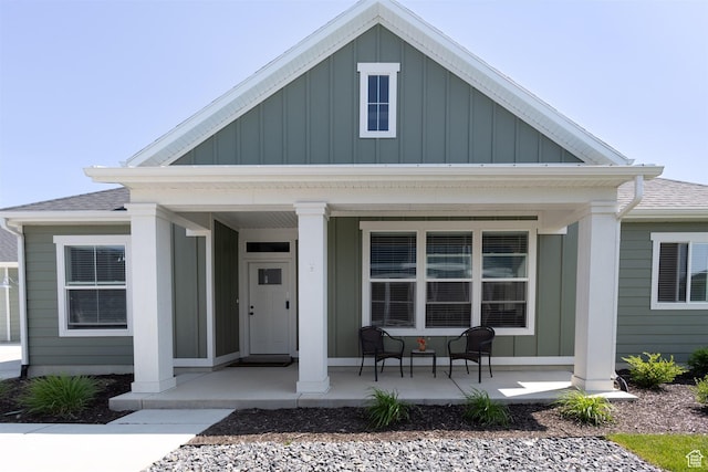 3795 S 4250 W Unit 446D, West Haven, UT 84401 - view of front facade with a porch, board and batten siding, and roof with shingles