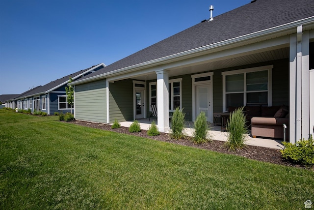 3795 S 4250 W Unit 446D, West Haven, UT 84401 - back of property featuring a lawn, roof with shingles, and covered porch