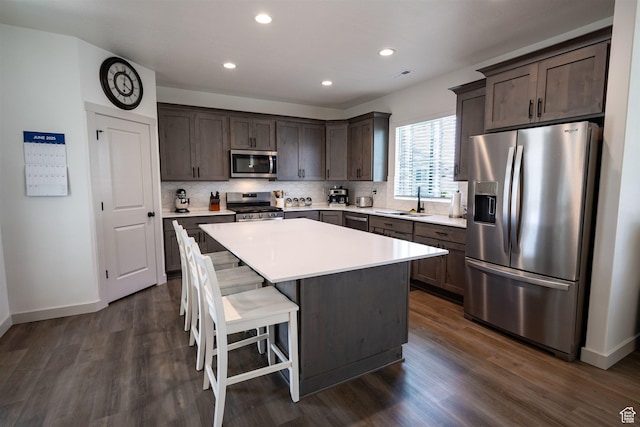 3795 S 4250 W Unit 446D, West Haven, UT 84401 - kitchen featuring appliances with stainless steel finishes, dark brown cabinetry, a sink, baseboards, and recessed lighting