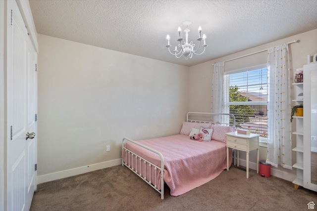 2127 Rio Grande Dr, Spanish Fork, UT 84660 - bedroom with a chandelier, carpet, baseboards, and a textured ceiling