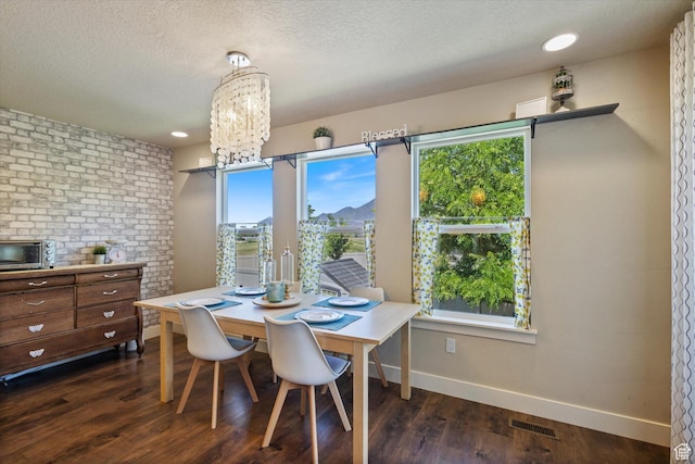 2127 Rio Grande Dr, Spanish Fork, UT 84660 - dining area featuring baseboards, dark wood-style floors, a chandelier, and a textured ceiling