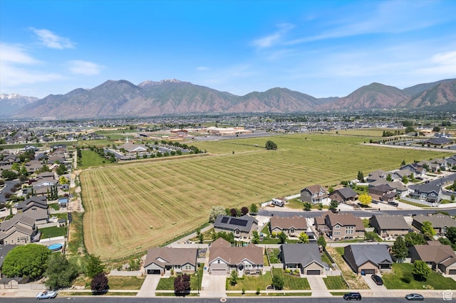 2127 Rio Grande Dr, Spanish Fork, UT 84660 - aerial overview of property's location featuring nearby suburban area and a mountain backdrop