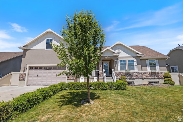 2127 Rio Grande Dr, Spanish Fork, UT 84660 - view of front of property featuring board and batten siding, a front lawn, concrete driveway, stucco siding, and a porch