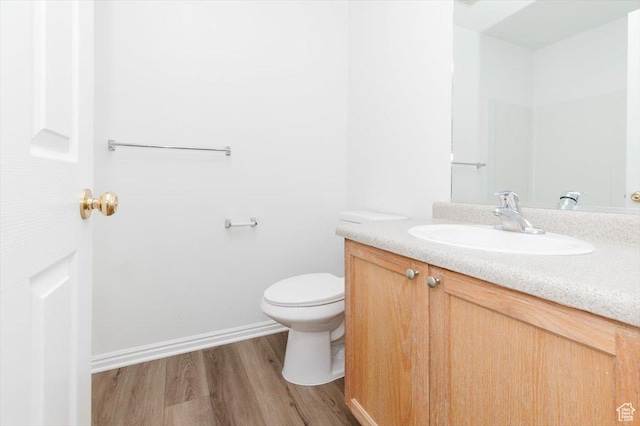 356 S 400 W, Logan, UT 84321 - bathroom featuring vanity, toilet, and wood finished floors