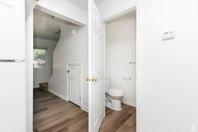356 S 400 W, Logan, UT 84321 - bathroom featuring wood finished floors, toilet, and baseboards