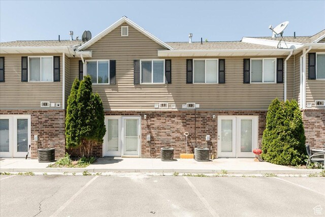 356 S 400 W, Logan, UT 84321 - view of building exterior with central AC and uncovered parking