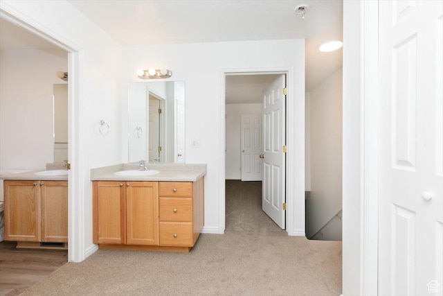 356 S 400 W, Logan, UT 84321 - bathroom with vanity, carpet flooring, and baseboards