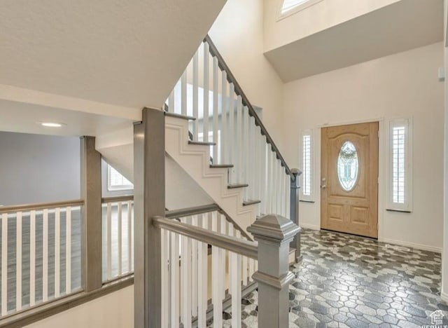 1231 E Tierney Cir, Sandy, UT 84094 - foyer featuring baseboards, stairs, and a towering ceiling