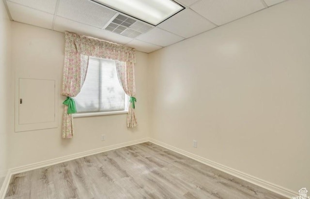 1231 E Tierney Cir, Sandy, UT 84094 - empty room featuring a paneled ceiling, wood finished floors, and baseboards