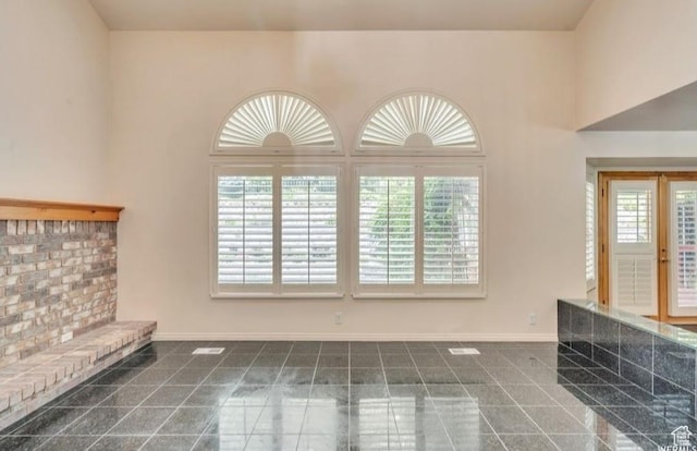 1231 E Tierney Cir, Sandy, UT 84094 - unfurnished living room with healthy amount of natural light and baseboards