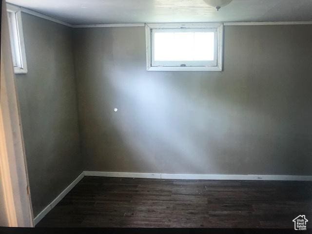 2726 S Cyprus Ln, Magna, UT 84044 - basement featuring dark wood finished floors, baseboards, and crown molding