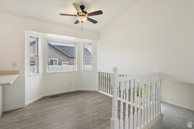 42 W 1980 S, Clearfield, UT 84015 - empty room with a ceiling fan, wood finished floors, baseboards, and vaulted ceiling