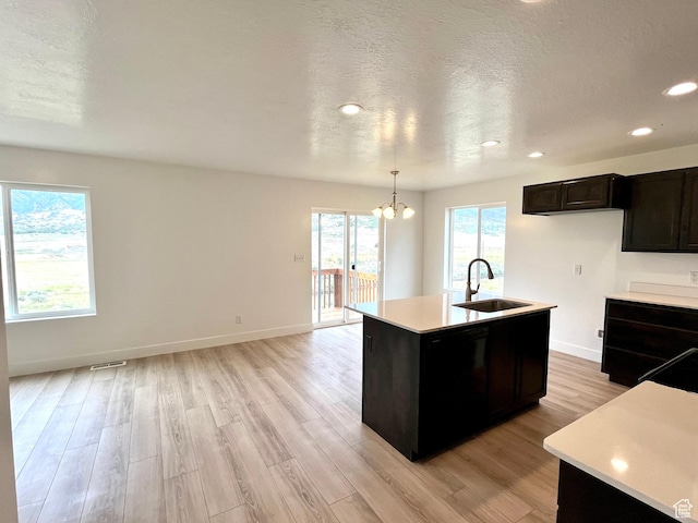 1937 S Freestone Blvd, Santaquin, UT 84655 - kitchen featuring a sink, light countertops, light wood-style floors, a chandelier, and recessed lighting