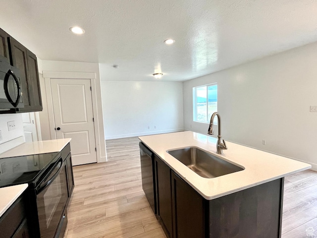 1937 S Freestone Blvd, Santaquin, UT 84655 - kitchen featuring a sink, black appliances, light countertops, light wood-style floors, and recessed lighting