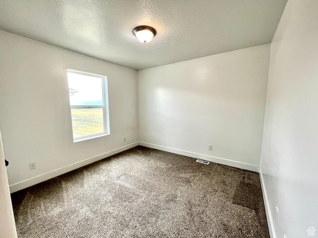 1937 S Freestone Blvd, Santaquin, UT 84655 - empty room with dark carpet, baseboards, and a textured ceiling
