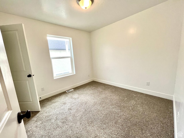 1937 S Freestone Blvd, Santaquin, UT 84655 - empty room featuring dark colored carpet and baseboards