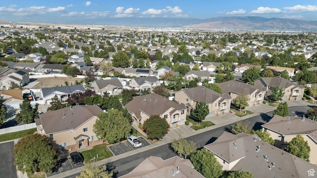 6882 W Bamburgh Way W, West Valley City, UT 84128 - aerial overview of property's location featuring nearby suburban area and a mountain backdrop