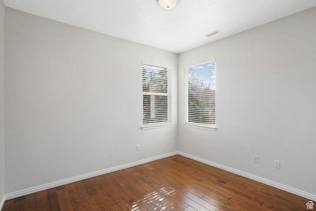 6882 W Bamburgh Way W, West Valley City, UT 84128 - empty room with hardwood / wood-style floors and baseboards