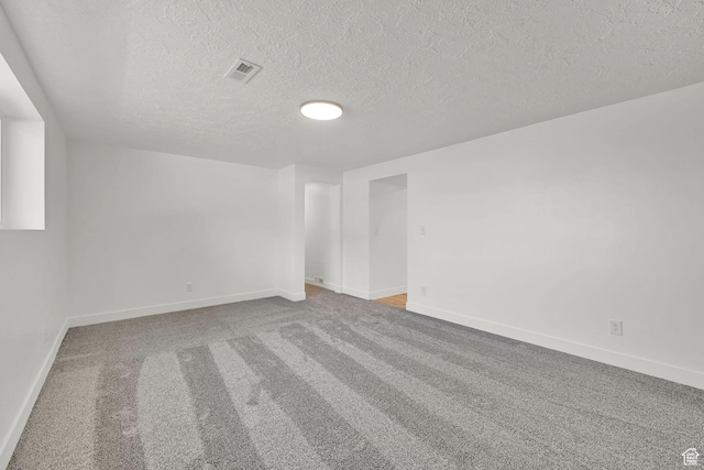 6034 S 2900 W, Roy, UT 84067 - empty room with a textured ceiling, baseboards, and carpet