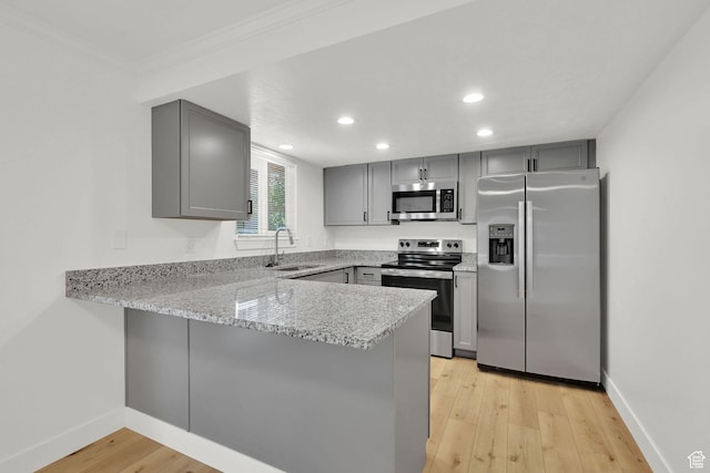 6034 S 2900 W, Roy, UT 84067 - kitchen featuring appliances with stainless steel finishes, gray cabinetry, a sink, a peninsula, and recessed lighting