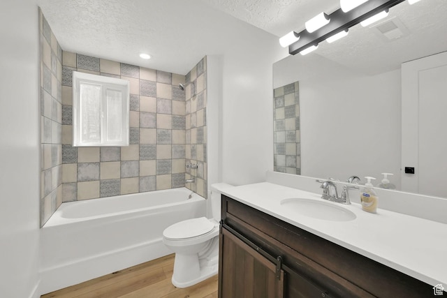 6034 S 2900 W, Roy, UT 84067 - bathroom with a textured ceiling, toilet, vanity, shower / tub combination, and wood finished floors