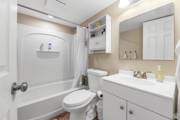1405 N Durocher Ln W, Tooele, UT 84074 - bathroom featuring vanity, toilet, and shower / bath combo