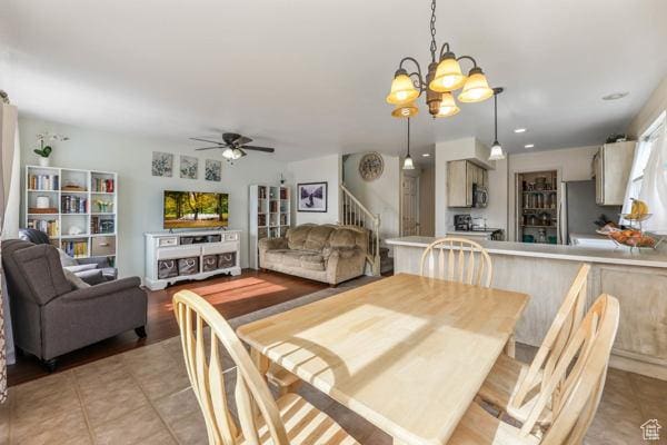 1405 N Durocher Ln W, Tooele, UT 84074 - dining area featuring stairway, a chandelier, ceiling fan, and light tile patterned floors