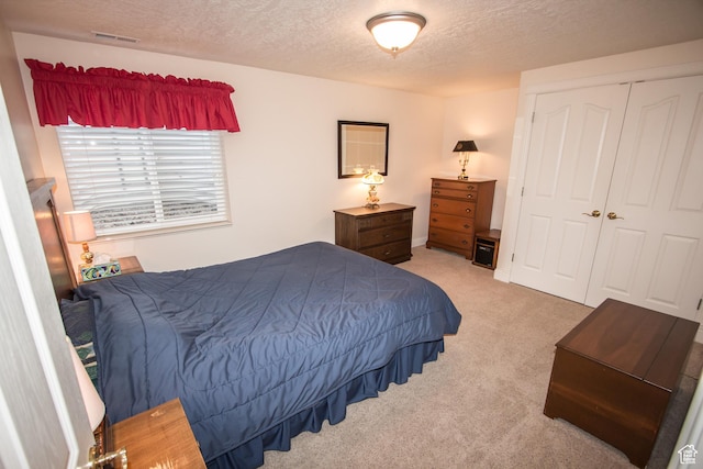 1655 E 3250 N, North Logan, UT 84341 - bedroom with a textured ceiling, light colored carpet, and a closet