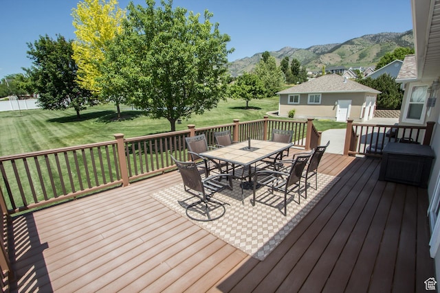 1655 E 3250 N, North Logan, UT 84341 - wooden deck with outdoor dining area, a mountain view, and a yard