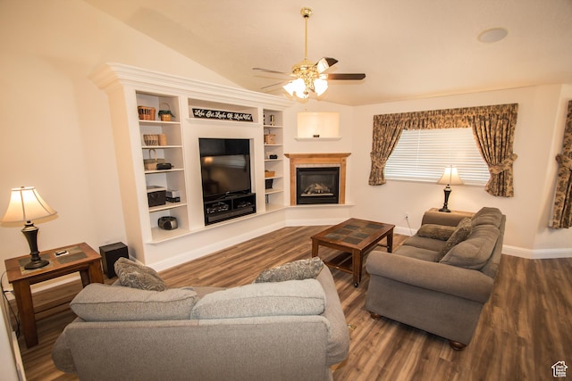 1655 E 3250 N, North Logan, UT 84341 - living room with ceiling fan, wood finished floors, vaulted ceiling, a glass covered fireplace, and baseboards