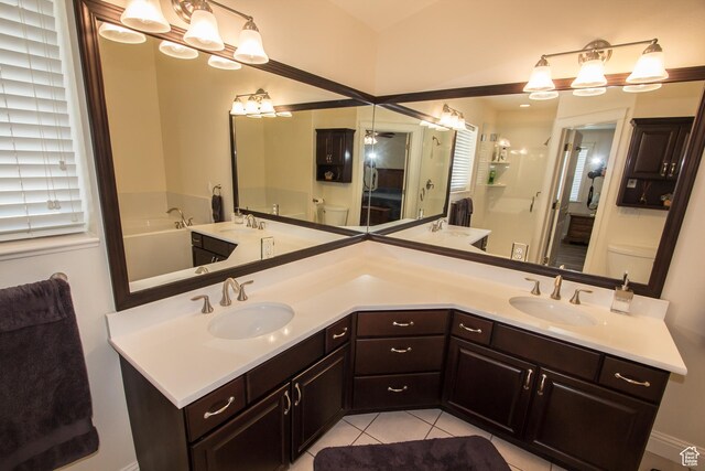 1655 E 3250 N, North Logan, UT 84341 - bathroom with toilet, double vanity, tile patterned floors, and a shower stall