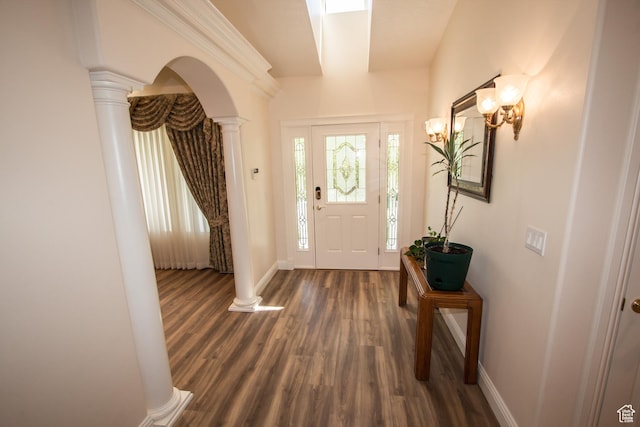 1655 E 3250 N, North Logan, UT 84341 - foyer entrance with ornate columns, dark wood-style flooring, baseboards, and arched walkways