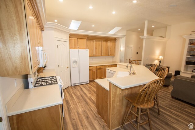 1655 E 3250 N, North Logan, UT 84341 - kitchen featuring white appliances, a sink, recessed lighting, a spacious island, and wood finished floors