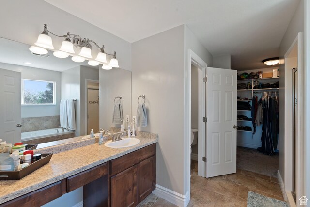 117 S 200 E, Kaysville, UT 84037 - full bath with a bath, a spacious closet, toilet, vanity, and baseboards
