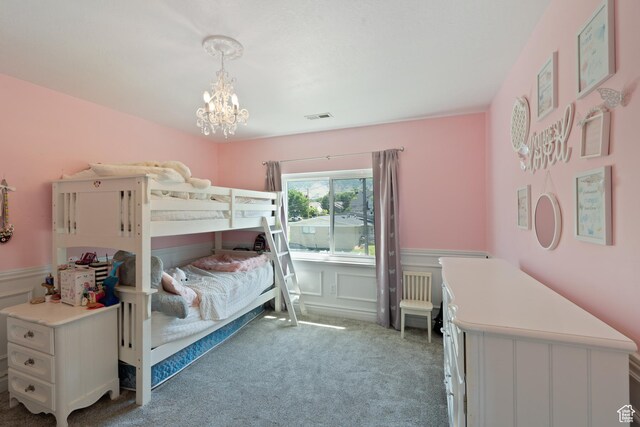 117 S 200 E, Kaysville, UT 84037 - carpeted bedroom featuring wainscoting, a chandelier, and a decorative wall