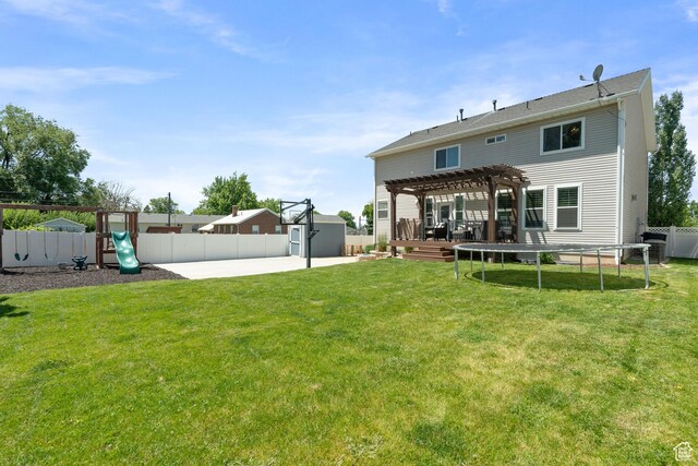 117 S 200 E, Kaysville, UT 84037 - back of property with a pergola, a trampoline, a playground, and a patio