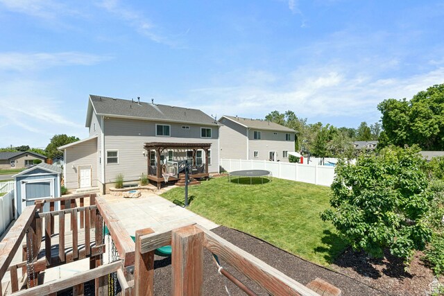 117 S 200 E, Kaysville, UT 84037 - rear view of property featuring a trampoline, a deck, a patio, and a residential view