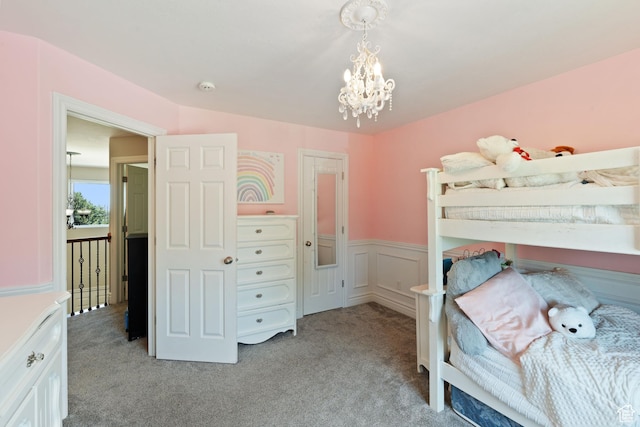 117 S 200 E, Kaysville, UT 84037 - bedroom with light carpet, a chandelier, and a wainscoted wall